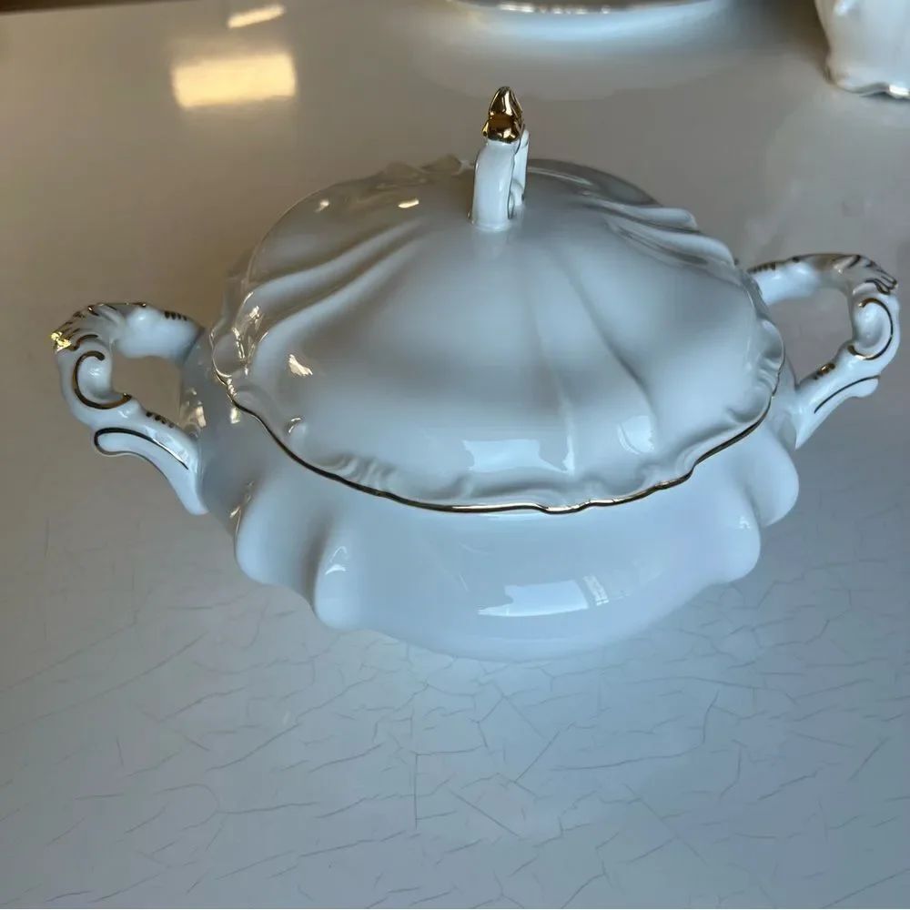 This is a piece of fine porcelain china produced by Hertel Jacob serving bowl